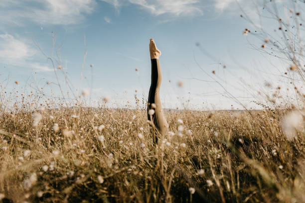 Beautiful young woman doing yoga in the nature.
